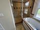 Bathroom shower and jacuzzi tub, tiled with patterned details at 2130 Pearidge Rd, Angier, NC 27501
