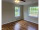 Bedroom featuring hardwood floors and natural light from the windows at 2130 Pearidge Rd, Angier, NC 27501