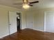 Bedroom featuring hardwood floors and access to the bathroom and closets at 2130 Pearidge Rd, Angier, NC 27501
