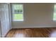 Bedroom with hardwood floors, natural light, and a double door closet at 2130 Pearidge Rd, Angier, NC 27501