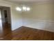 Dining room featuring hardwood floors and chandelier at 2130 Pearidge Rd, Angier, NC 27501