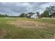 Charming single story home with white siding, dark roof, and a well-maintained spacious front yard at 2130 Pearidge Rd, Angier, NC 27501