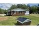 View of house showing brick and white siding exterior with black roof at 2130 Pearidge Rd, Angier, NC 27501