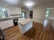 Charming kitchen showcasing granite countertops, a kitchen island, and updated appliances at 2130 Pearidge Rd, Angier, NC 27501
