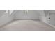 Unfinished attic space with neutral carpet and base trim at 2200 Paddstowe Main Way, Wake Forest, NC 27587