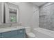Bathroom with large vanity, white marble countertops, and modern tub and shower at 2200 Paddstowe Main Way, Wake Forest, NC 27587