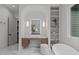 Elegant bathroom vanity area with decorative mirror and shelves at 2200 Paddstowe Main Way, Wake Forest, NC 27587