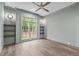 Empty bedroom showcases a large window and hardwood floors at 2200 Paddstowe Main Way, Wake Forest, NC 27587