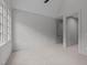 Bedroom featuring light gray walls, carpeted flooring, and a doorway at 2200 Paddstowe Main Way, Wake Forest, NC 27587