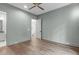 The bedroom has a neutral color palette with windows offering outdoor views at 2200 Paddstowe Main Way, Wake Forest, NC 27587