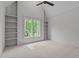 Bright bedroom with a large window offers a great view, and has stylish built-in shelving at 2200 Paddstowe Main Way, Wake Forest, NC 27587
