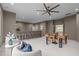 Bonus room with a bar and game table includes cozy seating areas and plenty of space for entertaining at 2200 Paddstowe Main Way, Wake Forest, NC 27587
