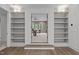 Bonus room framed by built-in shelving and cabinets; features a comfortable sitting area with view to the outdoors at 2200 Paddstowe Main Way, Wake Forest, NC 27587