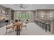 Entertaining bonus room features a full bar, game table, comfortable seating, and lots of natural light at 2200 Paddstowe Main Way, Wake Forest, NC 27587