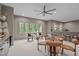 Game room with custom bar includes lots of seating, and bright natural light with views of the outdoors at 2200 Paddstowe Main Way, Wake Forest, NC 27587
