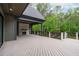 Expansive outdoor deck with stone fireplace, wood ceiling, and overlooking backyard at 2200 Paddstowe Main Way, Wake Forest, NC 27587