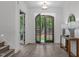 Inviting foyer with hardwood floors, double doors, and views of the outdoors at 2200 Paddstowe Main Way, Wake Forest, NC 27587