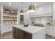 Kitchen with double islands, open shelving, stainless steel appliances, and custom cabinetry at 2200 Paddstowe Main Way, Wake Forest, NC 27587