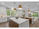 Spacious kitchen featuring double islands, stainless steel appliances, and an open layout at 2200 Paddstowe Main Way, Wake Forest, NC 27587