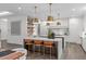 Modern kitchen with island seating and modern pendant lighting at 2200 Paddstowe Main Way, Wake Forest, NC 27587