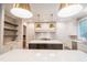 Modern kitchen with a large island, stainless steel appliances, and custom cabinetry at 2200 Paddstowe Main Way, Wake Forest, NC 27587