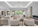 Cozy living room with comfortable seating, fireplace, and view of the private backyard at 2200 Paddstowe Main Way, Wake Forest, NC 27587