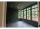 Stylish living room with expansive windows and modern lighting fixtures at 2200 Paddstowe Main Way, Wake Forest, NC 27587