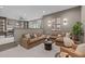 Cozy living room in neutral tones with comfortable seating, stylish decor, and easy access to the bar and game room at 2200 Paddstowe Main Way, Wake Forest, NC 27587