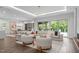 Expansive living room with fireplace, modern decor, and large windows for natural light at 2200 Paddstowe Main Way, Wake Forest, NC 27587