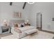 Relaxing main bedroom features neutral decor, accent lighting, and an elegant upholstered bed at 2200 Paddstowe Main Way, Wake Forest, NC 27587
