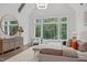 Bright main bedroom with a large window view and decorative wood beam accents at 2200 Paddstowe Main Way, Wake Forest, NC 27587