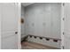 A well-organized mudroom with built-in storage cabinets and a bench at 2200 Paddstowe Main Way, Wake Forest, NC 27587