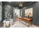Stylish home office featuring custom wainscoting, modern lighting, and inviting décor at 2200 Paddstowe Main Way, Wake Forest, NC 27587