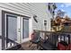 Relaxing deck area with outdoor seating and backyard access through bright glass doors at 2207 Otis St # B, Durham, NC 27707