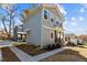 Two-story home showcasing light gray siding and manicured landscaping at 2207 Otis St # B, Durham, NC 27707