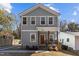 Charming two-story home featuring a welcoming front porch and light gray siding at 2207 Otis St # B, Durham, NC 27707
