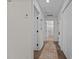 Bright hallway with hardwood floors leads to several rooms, including a bathroom at 2207 Otis St # B, Durham, NC 27707