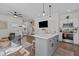 Kitchen island with bar stool seating that opens to the living area at 2207 Otis St # B, Durham, NC 27707