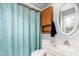 Bathroom featuring a white vanity, toilet, and a shower with an aqua curtain at 2319 Somers Ave, Burlington, NC 27215