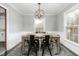 Stylish dining room featuring modern furnishings, neutral walls, and abundant natural light at 2319 Somers Ave, Burlington, NC 27215