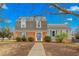 Charming two-story home with brick and vinyl siding, blue shutters and a neatly manicured lawn at 2319 Somers Ave, Burlington, NC 27215