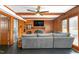 Cozy living room with wood paneled walls, fireplace and large sectional sofa at 2319 Somers Ave, Burlington, NC 27215