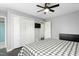 Neutral main bedroom with a plaid comforter, closet and ceiling fan at 2319 Somers Ave, Burlington, NC 27215