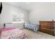 Twin bedroom with two metal framed beds, carpeting, and one window at 241 N Nolan Park Dr, Selma, NC 27576