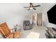 Well-lit bonus room featuring a ceiling fan, chairs, and access to the bathroom at 241 N Nolan Park Dr, Selma, NC 27576