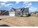 Well-kept single Gathering home showcasing its siding, roof, lawn, and curb appeal at 241 N Nolan Park Dr, Selma, NC 27576