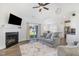 Cozy living room features fireplace, sliding doors to the yard, and seamless flow to the modern kitchen at 241 N Nolan Park Dr, Selma, NC 27576