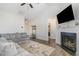 Spacious living room with vaulted ceilings, fireplace, and seamless access to a laundry and other rooms at 241 N Nolan Park Dr, Selma, NC 27576