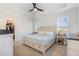 Primary bedroom with a tray ceiling, a ceiling fan, and neutral-toned walls at 241 N Nolan Park Dr, Selma, NC 27576