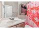 Charming bathroom with cabinet and Valentine's themed shower curtain, creating a cheerful atmosphere at 2440 Us 70 A, Selma, NC 27576